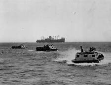 Amphibian tractors come ashore at Guadalcanal. off the shore of Gu- Old Photo picture