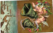 Vintage Postcard- Cherubs on bells above a city, A Merry Christmas picture