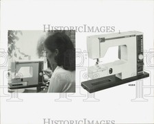 1979 Press Photo Woman uses sewing machine with memory capacity for 14 stitches picture