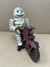 Cast Iron Michelin Man Tire Guy Figure on a Motorcycle picture