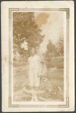 Woman in Garden with Ghost Twin Spooky Double Exposure Effect Vintage Snapshot picture