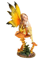 Yellow and Orange Winged Pixie Fairy Figure Sitting on a Mushroom H= 8.75 inches picture