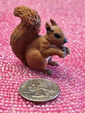 Miniature Squirrel Eating Acorn Sitting Fluffy Tail Brown Collectible Animal picture