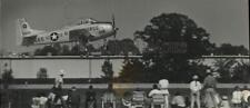 1989 Press Photo Vintage Air Force Trainer passes over airport in Oshkosh picture