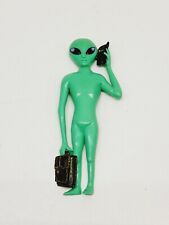 Green Alien Holding Cell Phone And Briefcase Magnet picture
