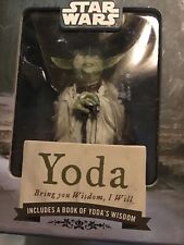 yoda figure and Book Of Wisdom picture