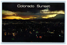 c1960s Sunset Over West Denver, Sets Behind The Rocky Mountains CO Postcard picture