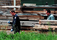 LOOKING EVIDENCE State police investigators look evidence around p- Old Photo picture