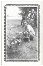 Man in Hat Cooking Campfire Lake Camping Fishing Vintage Found Photo picture
