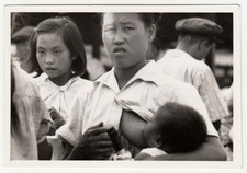 Vintage Photograph Woman Breastfeeding Baby with Young Girl Candid Street Scene picture