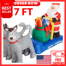 7 Foot Long Christmas Inflatable Santa Claus on Sleigh with Husky Dogs and Gift. picture