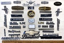 40 PIECE LOT PLASTIC CAR EMBLEMS - VARIOUS MAKES & MODELS - GM, FORD, IMPORTS + picture