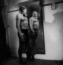Author Ernest Hemingway admiring his mirror image bare-cheste- 1940s Old Photo picture