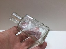 Small Antique Boots The Chemist Medicine Bottle. picture