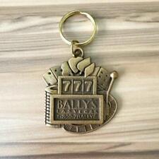 Vintage Bally's Las Vegas Hotel Casino Brass-Colored Metal Slot Machine Keychain picture
