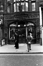 Two British policemen passing by WE Hill Sons violin shop New Bond- Old Photo picture