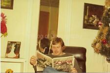 Young Man Reading Screw Magazine FOUND PHOTO Color Snapshot VINTAGE 911 12 E picture