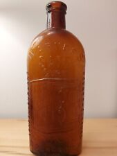 Antique Embossed Warner's Safe Cure Amber Bottle - 3 Cities 9.5
