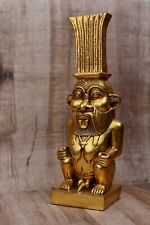 Great statue of god Bes, god protector of households stone covered by gold leaf picture