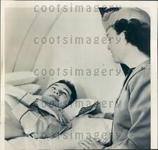 1950 Airline Hostess Winona Powell Tends to Athlete w Spinal Injury Press Photo picture