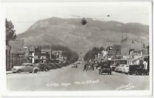 1940 Cody, Wyoming - REAL PHOTO Main Street, Signs, Autos - Vintage Postcard picture