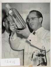 1955 Press Photo Dr. Jonas Salk Poses with Bottle of Polio Vaccine, Pittsburgh picture